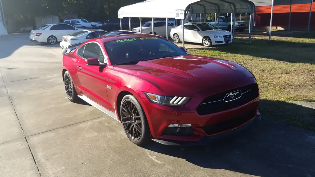 Ruby red Ford Mustang GT on the Z Cars of Ocala lot at golden hour